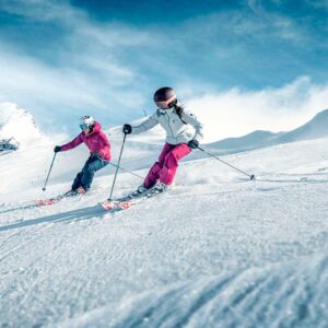 couple taking ski lessons on the slope in Klosters