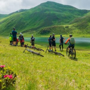 Group of Bikers by the lake and the mountains in Klosters